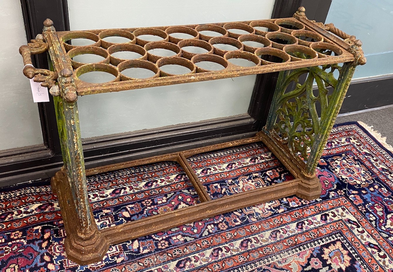 A Victorian Coalbrookdale style cast iron Country House 24 division stick stand, width 97cm, depth 35cm, height 60cm